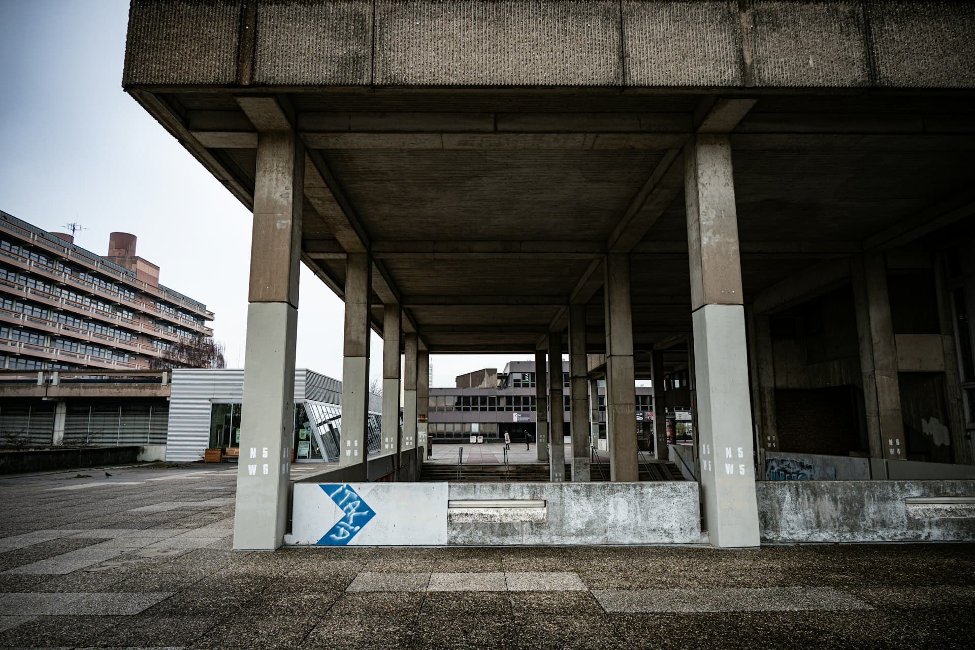 Concrete brutalist architecture with large structural columns — imagery of a chosen foundation